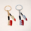 Gold and Silver Tone Blood Splatter Knife Split Ring Keychains view 2