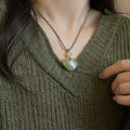 Green Cloud Pendant Necklace on Layered Brown Cords view 4