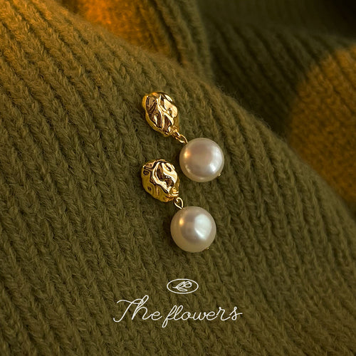 Gold molten nugget pearl drops on olive knit sweater