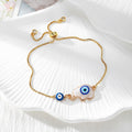 Gold Tone Blue Evil Eye Double-Dangle Slider Bracelets in Eight Designs view 9