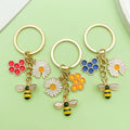 Bee and Honeycomb Charm Keychains Featuring Butterfly Across 47 Pictured Variations view 2