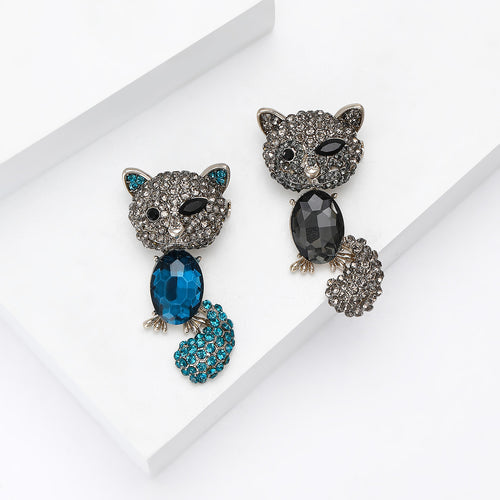 Product image 2 showing the crystal cat brooch with curled tail in blue or gray.