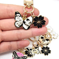 Gold Tone Butterfly Skull and Cherry Blossom Clip Keychains view 4