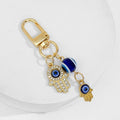Gold Tone Evil Eye Charm Keychain With Hamsa Hand Accent view 5