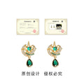 Gold Tone Star And Moon Stud Earrings With Green Teardrop view 3