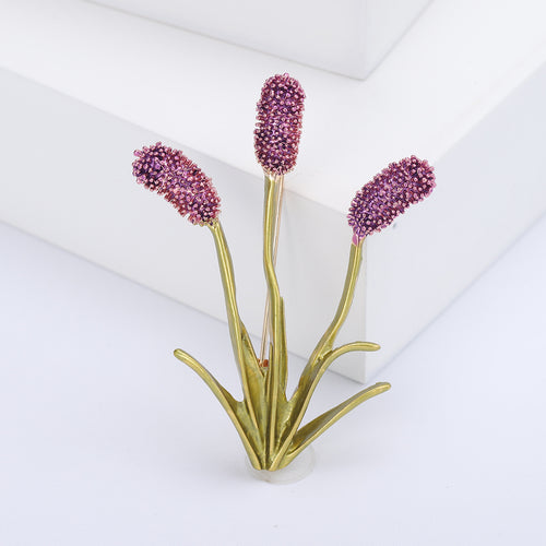 Purple crystal cattail seed head brooch on white blocks
