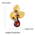 Three Textured Leaf Brooch With Large Burgundy Teardrop Crystal view 6