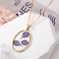 Gold Tone Oval Purple Petal Resin Pendant Necklace and Drop Earrings view 2