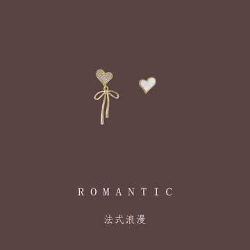 Gold Tone Bow And White Heart Asymmetric Stud Earrings
