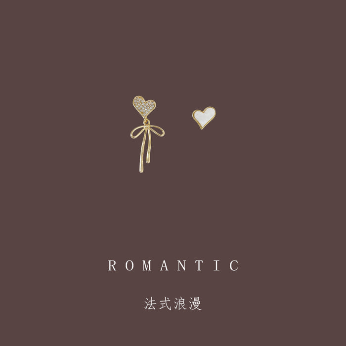 Gold Tone Bow And White Heart Asymmetric Stud Earrings