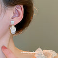 White Shell Disc Drop Earrings with Gold Tone Studs view 3