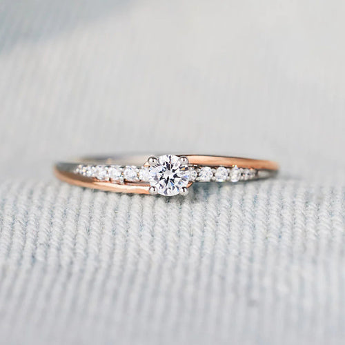 Second product view showing two-tone round solitaire split band ring