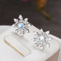 Blue Center Snowflake Stud Earrings in Silver Tone view 2