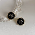 Black Enamel Round Camellia Stud Earrings Gold Tone Prongs view 1