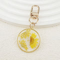 Gold Tone Round Pressed Daisy Resin Clip Keychains view 10