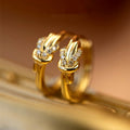 Gold Tone Knot Detail Crystal Accent Huggie Hoop Earrings view 2