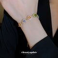 Gold Tone Bracelet With Seven Multicolor Round Crystal Halo Links view 3