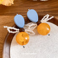 Blue and Amber Bow Drop Earrings with Pearl Strands view 2
