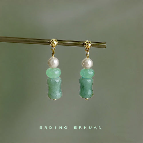 Mint green bamboo glass pearl drops hanging on gold rod