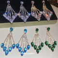 Gold Crystal Teardrop Chandelier Stud Earrings with Polished Metal Details view 1