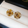 Gold Tone Brown Cabochon Floral Stud Earrings With Decorative Metal Accents view 4