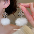 Snowflake Faux Fur Pom Pom Drop Earrings in White and Black view 3