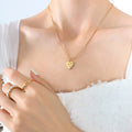 Gold Heart Pendant Snake Chain Necklace Three Clear Stones view 3