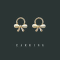 Gold Tone Clear Stone Wreath And Pearlescent Bow Stud Earrings view 3
