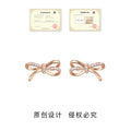 Pave Bow Stud Earrings Silver and Rose Gold Metal Alloy view 3