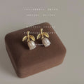 Gold Leaf Stem Stud Earrings With White Pearl Flower Buds view 1