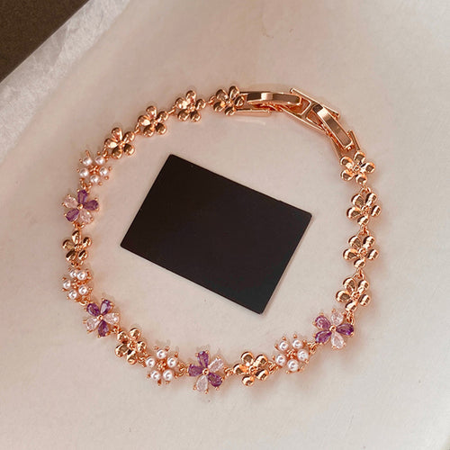 Rose gold flower pearl crystal bracelet circle on cream fabric