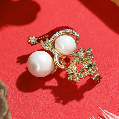 Pearl snowman brooch close-up hat and scarf detail