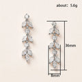 Silver Tone Graduated Leaf Drop Earrings with Clear Stones view 4