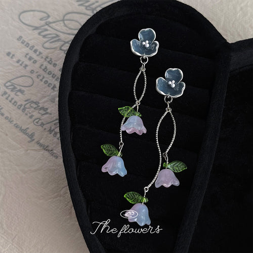 Dark-blue flower pale-lavender bell-branch drops in the first product display.