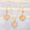 Gold Tone Crystal LOVE Heart Pendant Necklace and Huggie Earrings view 1