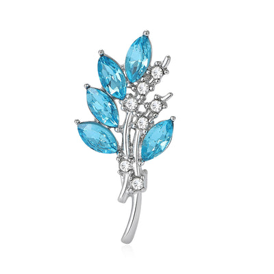 Crystal Leaf Sprig Brooch shown against a white display background