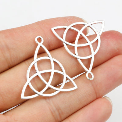silver tone triquetra knot pendant charm assortment showing the available designs and finishes