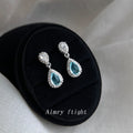 Silver Tone Aqua Teardrop Stone Halo Drop Stud Earrings view 1