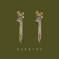 Gold Tone Bow Purple Flower Pearl And Chain Tassel Stud Earrings view 1