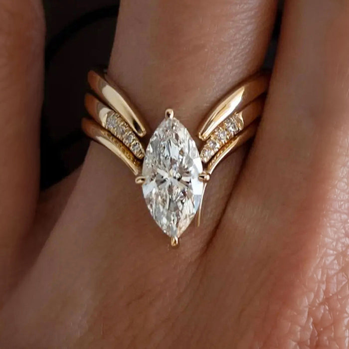 Marquise Solitaire Wing Split Ring In Gold And Silver Tones