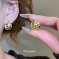 Leopard Pattern Curved Hoop Earrings In Gold And Silver view 3