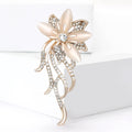 Crystal Floral Spray Brooch With Polished Metal And Sculpted Decorative Details view 1