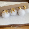 Gold Tone Crystal Flower White Pom Pom Hoop Earrings view 3