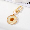 Gold Tone Pressed Flower Resin Clip Keychains in Eight Round and Irregular Designs view 7