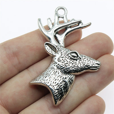 Close view of the detailed deer head pendant charm showing textured deer head with branching antlers