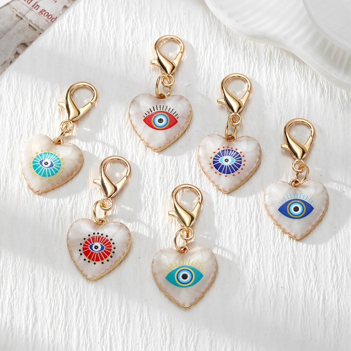 Gold Tone Evil Eye Heart Charms with Large Lobster Clasps in Six Designs