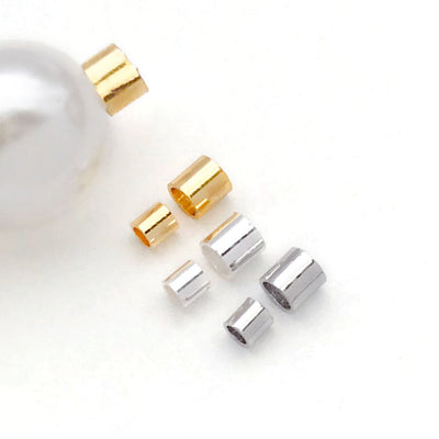 Front overview of short round tube crimp beads in two sizes arranged by finish and size