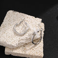 Silver Tone Oval Hoop and White Ribbon Bow Stud Earrings view 3