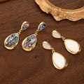 White Double Teardrop Gold Tone Long Dangle Earrings view 2