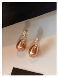 Gold Teardrop Pearl Earrings With Clear Stone Tops view 6